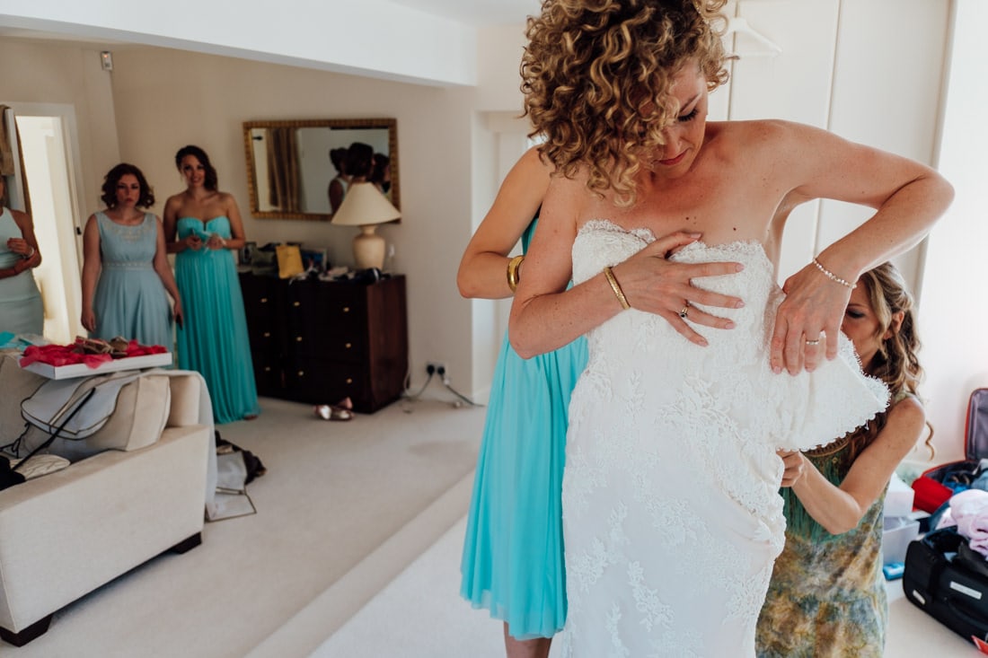 bride putting dress on