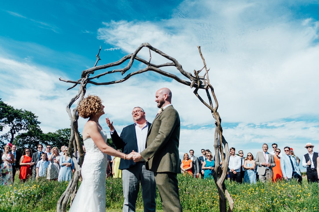 outdoor wedding ceremony in a meadow
