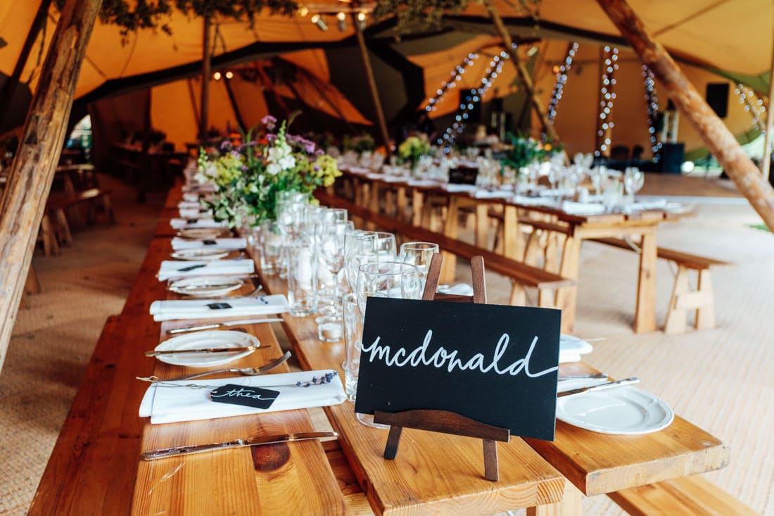 wedding table decorations at tipi wedding in a back garden in kent