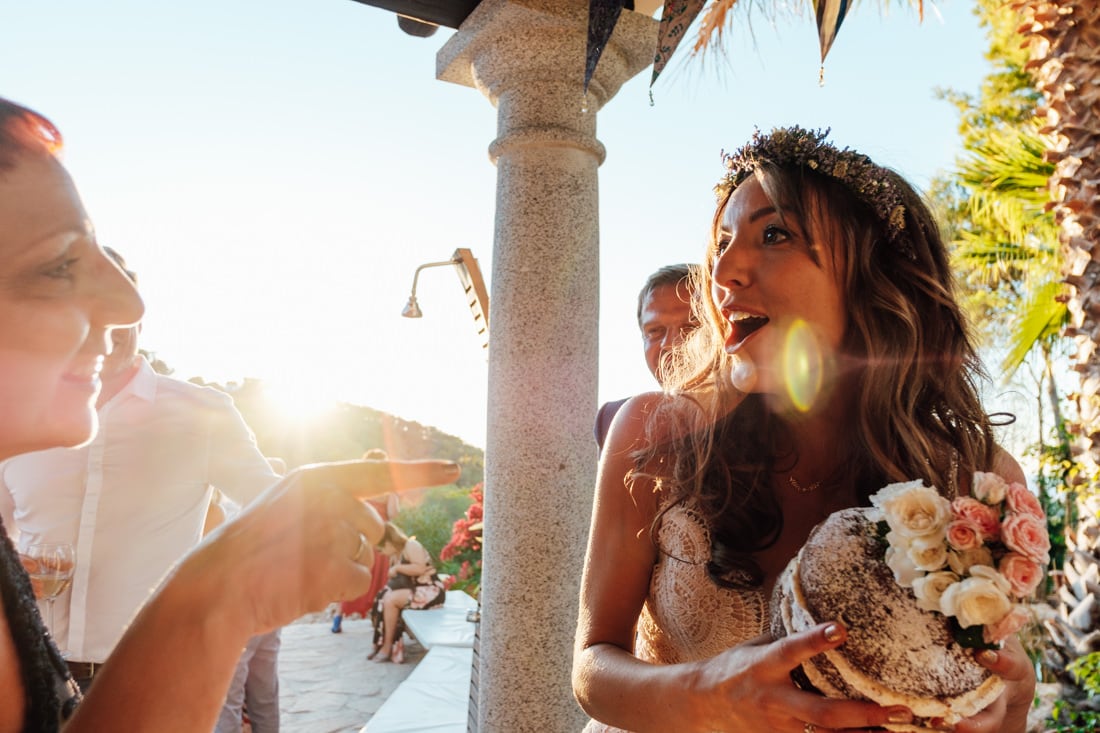 bride cutting cake at ibiza travel wedding in a villa