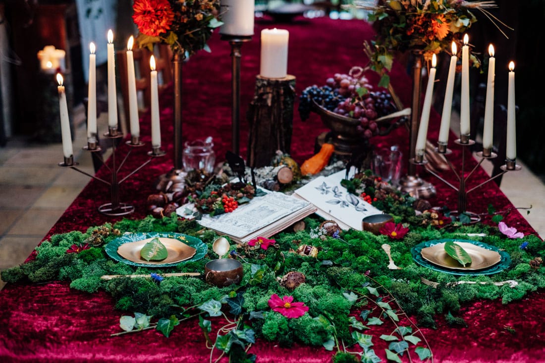 wedding table decor autumn wedding red velvet and moss and candles