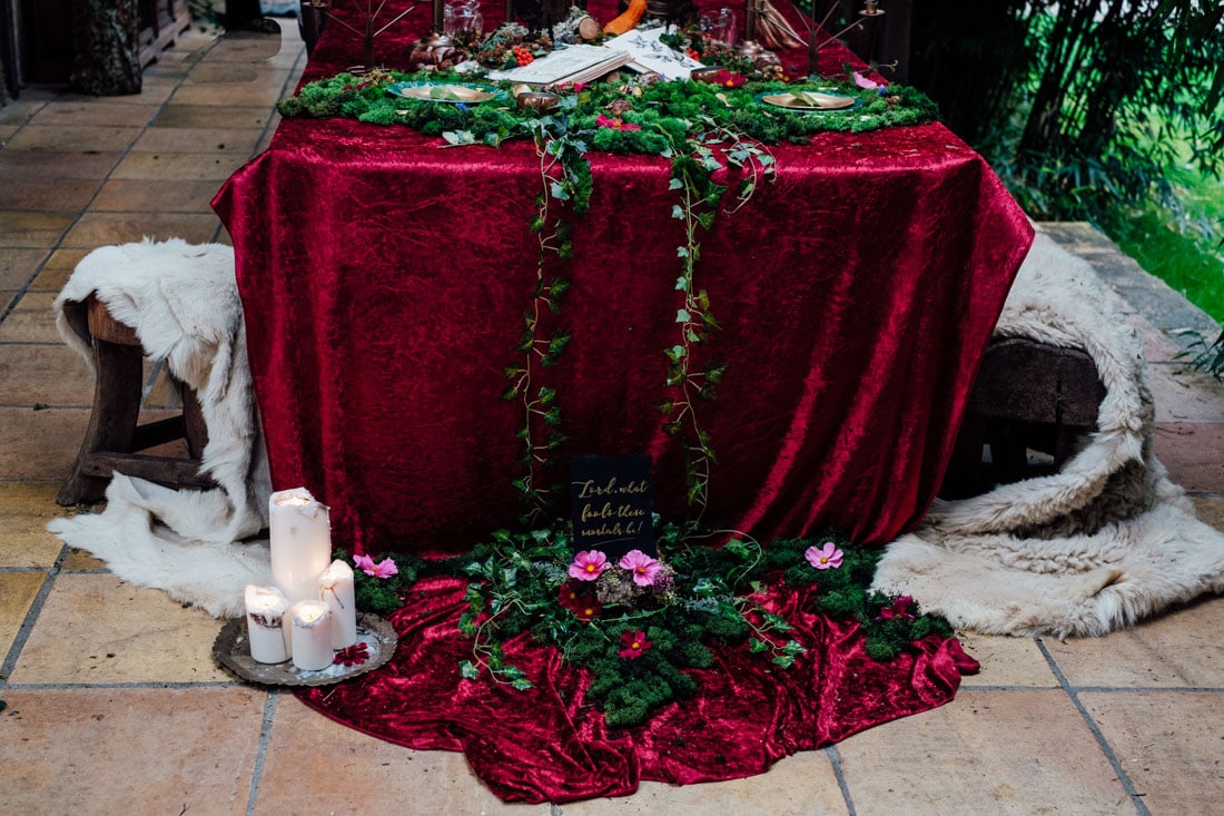 wedding table decor autumn wedding red velvet and moss and candles