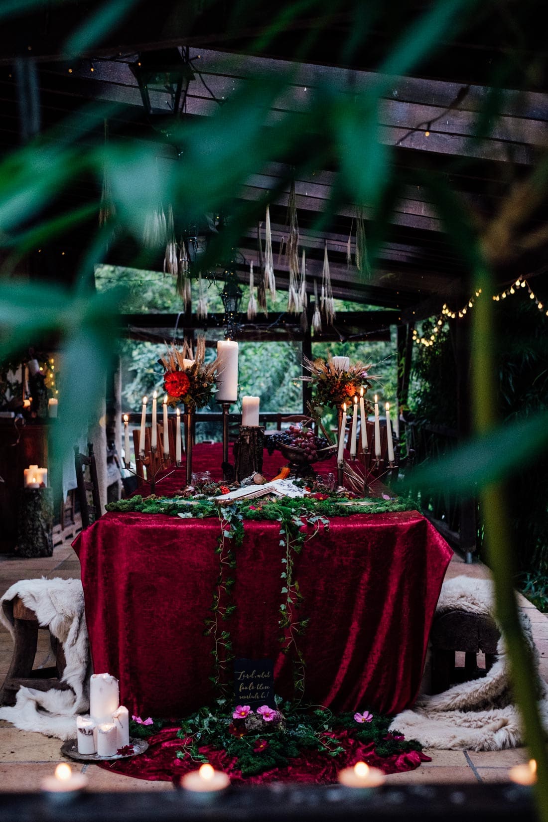 wedding table decor autumn wedding red velvet and moss and candles