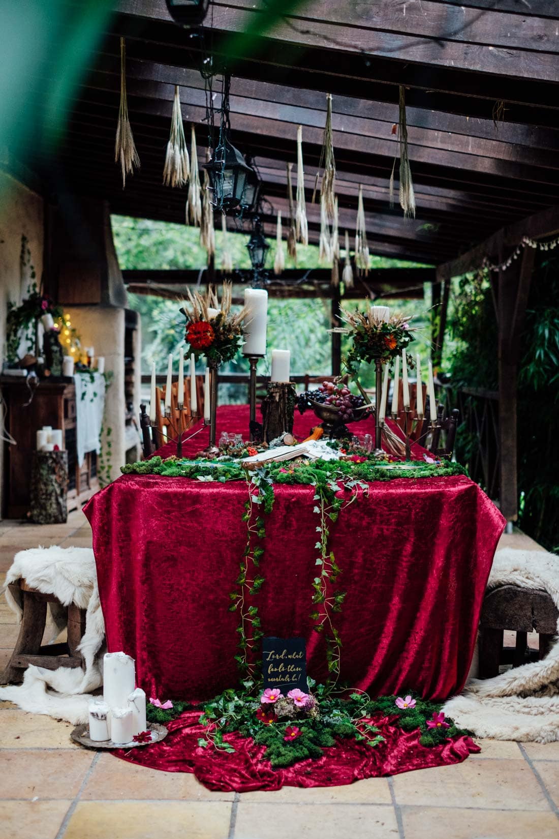 wedding table decor autumn wedding red velvet and moss and candles