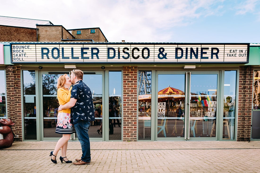 bride and groom kissing outside at roller rink at dreamland margate kent