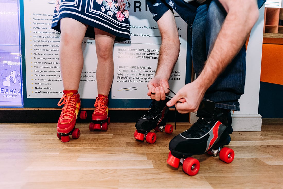 bride and groom at roller rink at dreamland margate kent