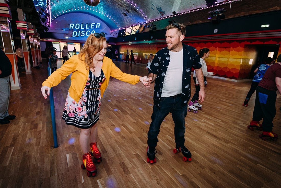 bride and groom skating at roller rink at dreamland margate kent