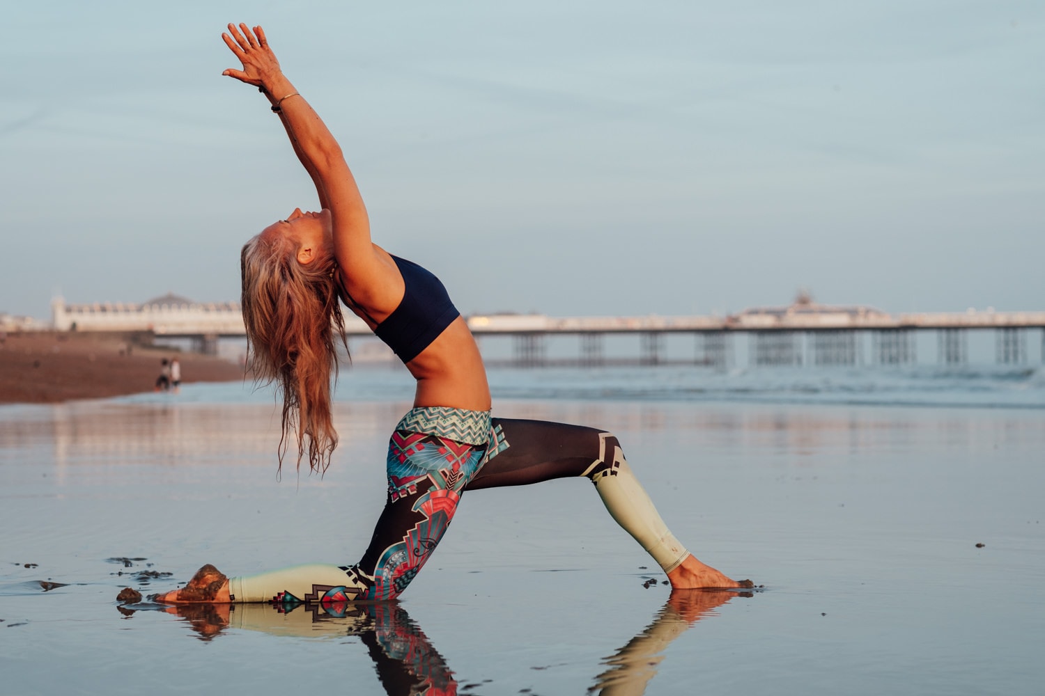 yoga pose on the beach for corporate headshot photography in brighton at sunset
