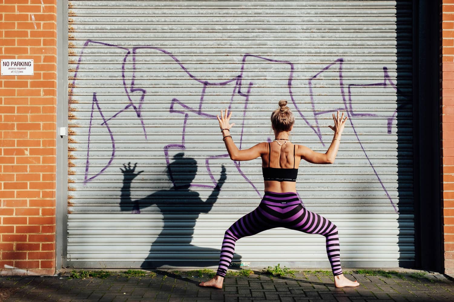 yoga photoshoot for corporate headshot photography in front of brighton graffiti