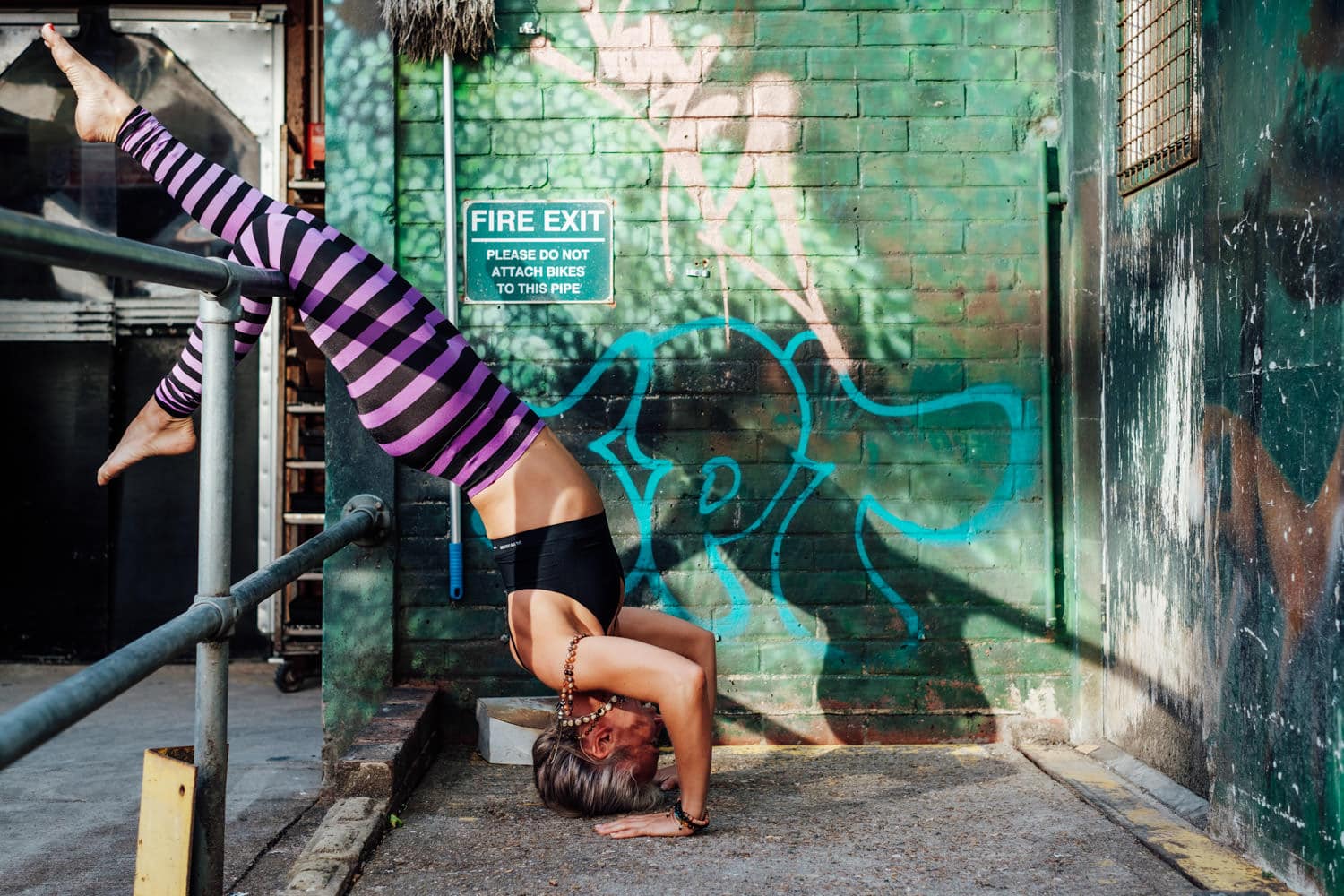 yoga photoshoot for corporate headshot photography in front of brighton graffiti
