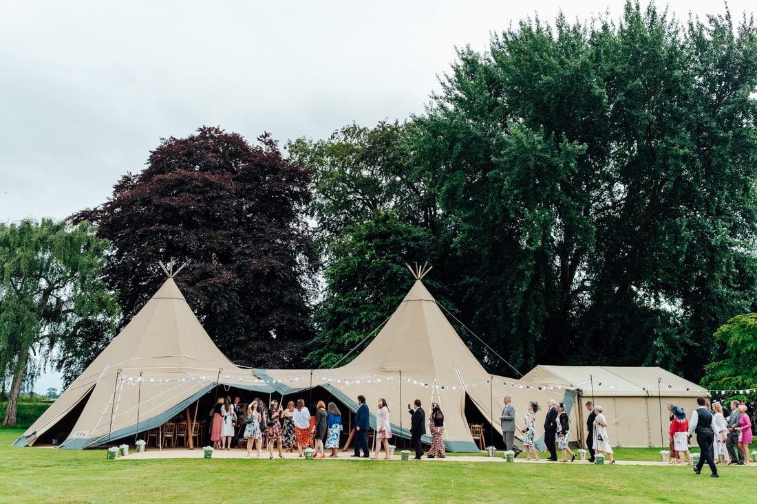 outdoor wedding ceremony back garden and tipi